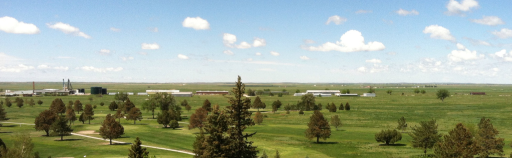 View of golf course with clouds